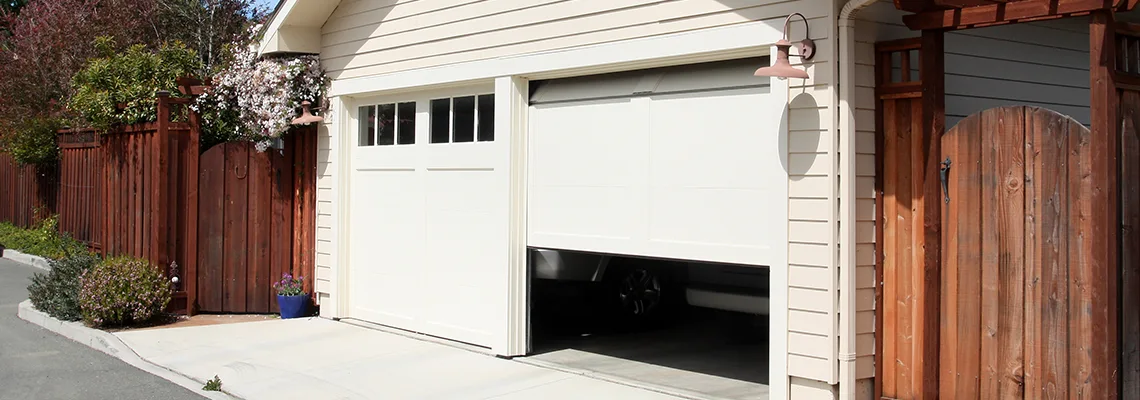 Fix Metal Garage Door Jerking in Weston